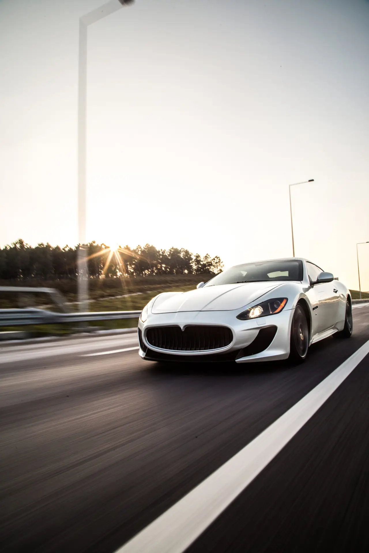 sliver-metallic-color-sport-car-driving-with-high-speed-road